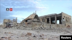 FILE - Nabd Al-Hayat hospital, destroyed by an airstrike, is seen in Hass, Idlib province, Syria, May 6, 2019, in this still image taken from a video on May 9, 2019.