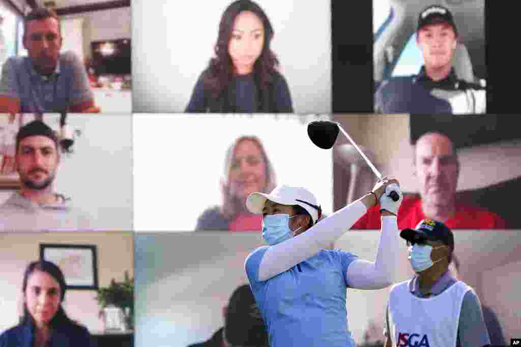 Jing Yan of China hits off the first tee as virtual fans look on during the first round of the U.S. Women&#39;s Open golf tournament in Houston, Texas.