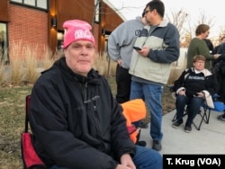 Ed Hotchkin voted for Hillary Clinton in the 2016 election, but he is eyeing Senators Bernie Sanders and Elizabeth Warren this time. He attended the Warren rally in Des Moines, Jan. 5, 2019, in a pink "2010 Feel The Bern! hat.