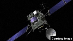 Gambar komputer pesawat ruang angkasa Eropa 'Rosetta' dengan pendarat yang bernama Philae (warna biru di tengah).