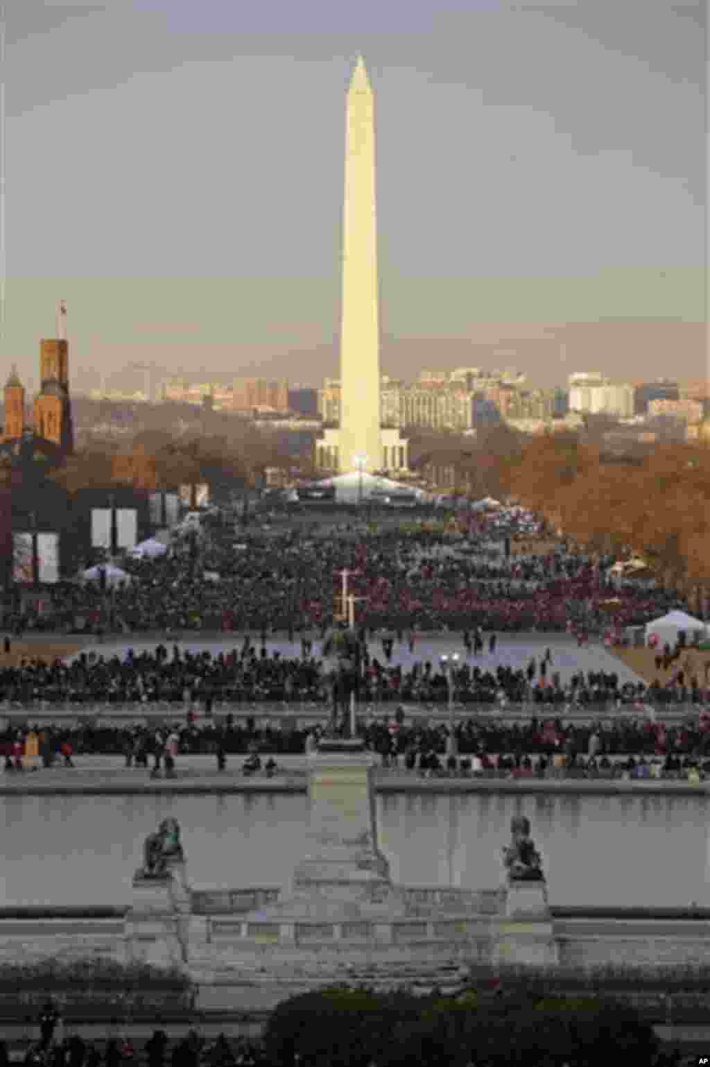 The crowd starts to fill up the National Mall early in the morning before the ceremonial swearing-in of President Barack Obama at the U.S. Capitol during the 57th Presidential Inauguration in Washington, Monday, Jan. 21, 2013. (AP Photo/Pablo Martinez Mon