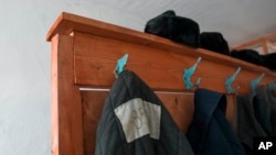 FILE - Prisoners' clothes are seen in a museum at a now defunct Soviet-era prison camp near the Siberian city of Perm, Russia, March 6, 2015. To some, the reintroduction of forced labor in Russia signals a return to the notorious Gulag prison system.