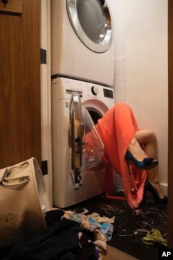This photo shows a self-portrait by artist Lara Alcantara in her home in the Brooklyn borough of New York. The Venezuelan photographer has channeled her pandemic-related anxiety through a series of self-portraits that sometimes put her in an imaginary world. (Lara Alcantara via AP)