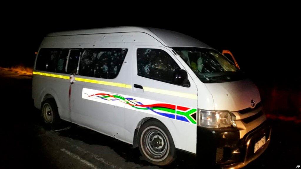 A minibus with bullet holes on its side is seen on the road between Weenen and Colenso, in KwaZulu Natal province, South Africa, early Sunday, July 22, 2018.