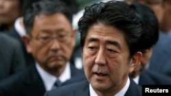 FILE - Japan's Prime Minister Shinzo Abe speaks to the media.