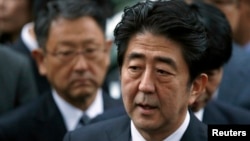 FILE - Japan's Prime Minister Shinzo Abe speaks to the media.