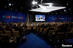 Participants attend the NATO Summit in Warsaw, Poland, July 8, 2016.