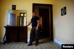 Self-employed Antonio Viltres shows the living room of his home which is being prepared to become a bed-and-breakfast and coffee shop, in Havana, Cuba, Aug. 1, 2017.