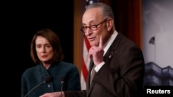 Senate Minority Leader Chuck Schumer, accompanied by House Minority Leader Nancy Pelosi, speaks at a news conference about the omnibus spending bill passed by Congress in Washington, March 22, 2018.