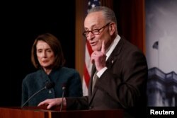 FILE - Senate Minority Leader Chuck Schumer, accompanied by House Minority Leader Nancy Pelosi, speaks at a news conference about the omnibus spending bill passed by Congress in Washington, March 22, 2018.