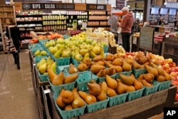 In this May 3, 2017, photo, fresh fruit is displayed in a Whole Foods Market grocery store, in Upper Saint Clair, Pennsylvania.