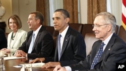 U.S. President Barack Obama looks up during a meeting with Congressional leaders in the Cabinet Room to discuss ongoing efforts to find a balanced approach to deficit reduction at the White House, July 11, 2011