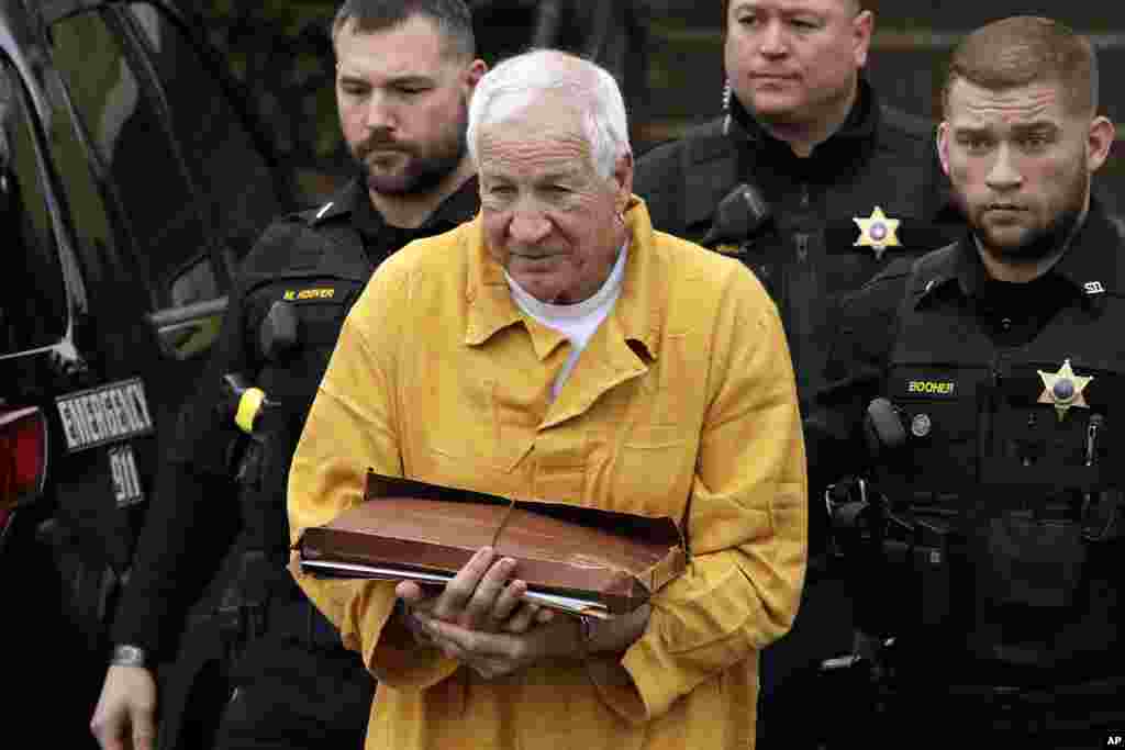 Former Penn State University assistant football coach Jerry Sandusky, center, arrives at the Centre County Courthouse in Bellefonte, Pennsylvania, to be resentenced. Sandusky was convicted of 45 counts of child sexual abuse in 2012.