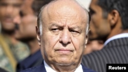 Yemeni President Abed Rabbo Mansour Hadi looks on during a funeral service for Major General Salem Ali Qatan, the commander of military forces in the south of Yemen, Sanaa, June 19, 2012.