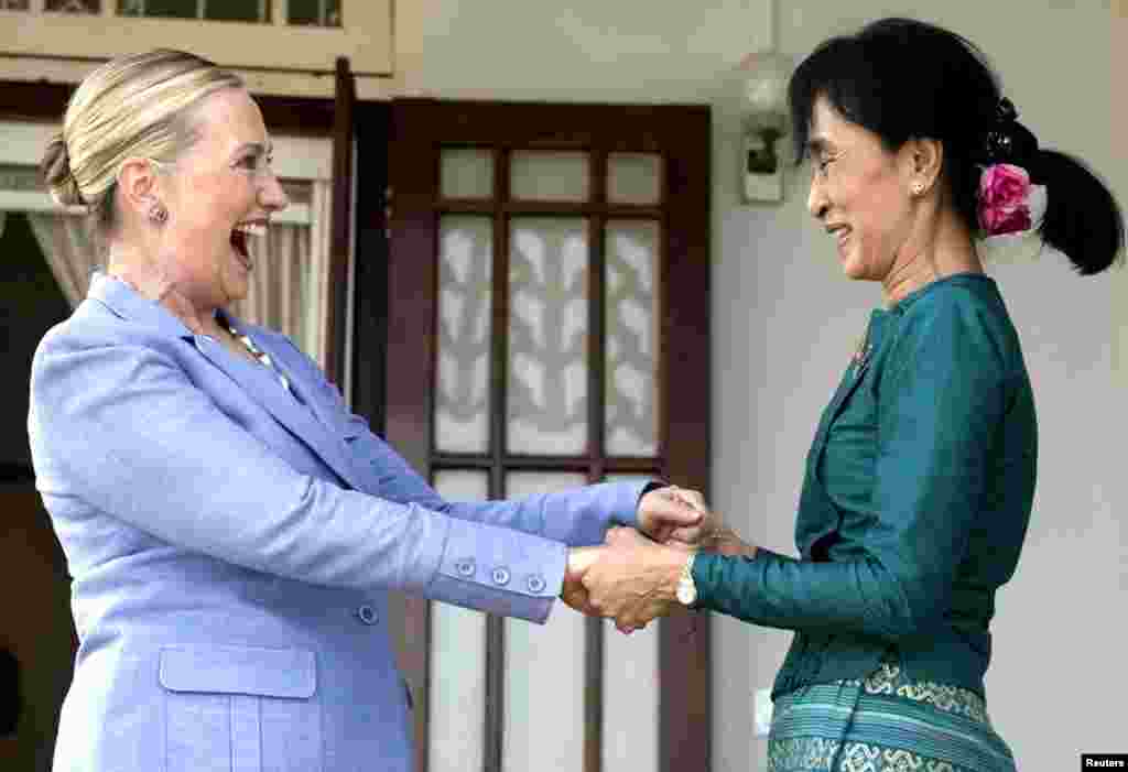 Pro-democracy leader Aung San Suu Kyi with Clinton after a meeting at Suu Kyi's residence in Rangoon, Burma, December 2, 2011. 