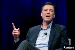 FILE - Former FBI director James Comey speaks during an interview with Axios Executive Editor Mike Allen at George Washington University in Washington, April 30, 2018.