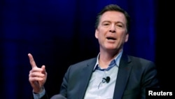 FILE - Former FBI director James Comey speaks during an interview with Axios Executive Editor Mike Allen at George Washington University in Washington, April 30, 2018.