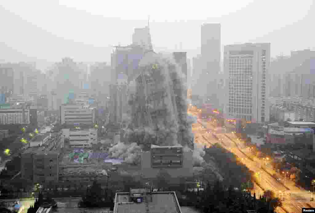 A building crumbles during a controlled demolition in Xi&#39;an, Shaanxi province, China.