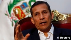 FILE - Peru's President Ollanta Humala speaks during an interview at the government palace in Lima, July 12, 2014. 
