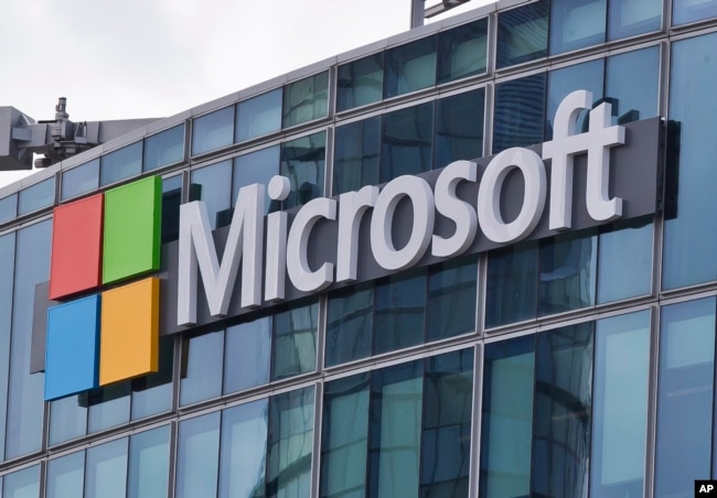 FILE - This April 12, 2016 file photo shows the Microsoft logo in Issy-les-Moulineaux, outside Paris, France.