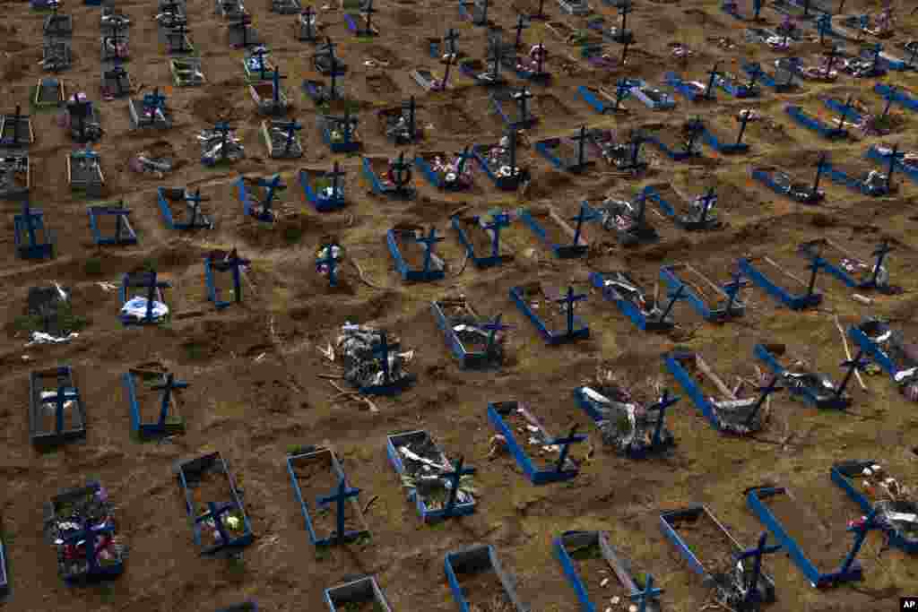 Graves of people who died in the past 30 days fill a new section of the Nossa Senhora Aparecida cemetery, amid the new coronavirus pandemic in Manaus, Brazil, May 11, 2020.