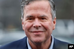 FILE - Republican presidential candidate, former Florida Gov. Jeb Bush visits a polling place at the Eastlan Baptist Church in Greenville, S.C.