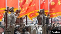 Troops in military vehicles take part in the military parade marking the 70th founding anniversary of People's Republic of China, on its National Day in Beijing, China October 1, 2019. 