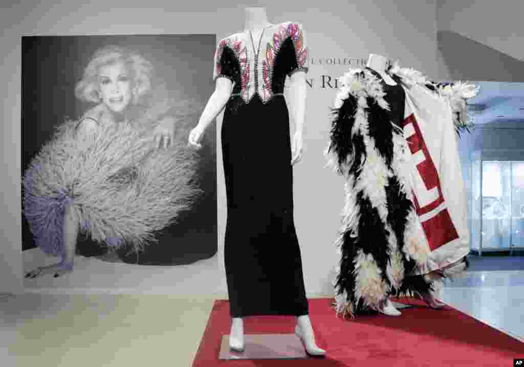 A beaded evening gown, center, owned by the late comedian Joan Rivers, is displayed at Christie&#39;s in New York. The Private Collection of Joan Rivers has more than 200 lots to be auctioned in a live sale on June 22 with about 80 more offered online the following day.