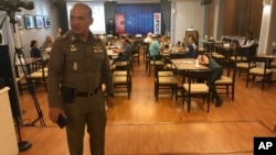 A Thai policeman stands inside Foreign Correspondents' Club of Thailand during an event titled: "Will Myanmar's General Ever Face Justice for International Crimes" in Bangkok, Thailand, Sept. 10, 2018.