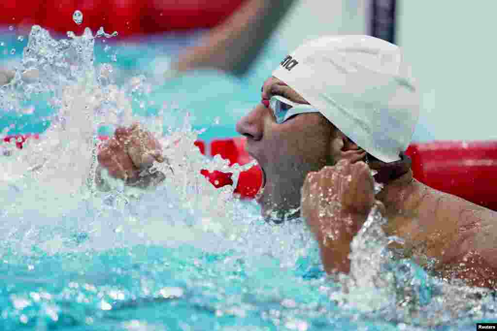 Ahmed Hafnaoui of Tunisia reacts after winning gold in the Men&#39;s 400m Freestyle - Final. REUTERS/Aleksandra Szmigiel/ &nbsp;