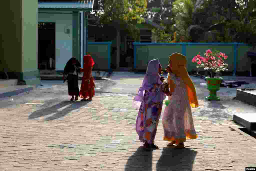 Muslim children play outside a mosque in North Penajam Paser regency, East Kalimantan province, Indonesia.