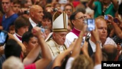 Pope Francis arrives to lead a mass marking World Day of Prayer for the Care of Creation in Saint Peter's Basilica at the Vatican, Sept. 1, 2015.