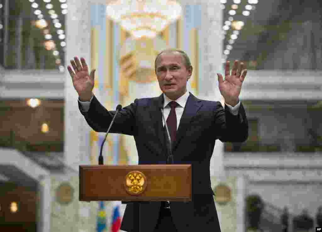 President Vladimir Putin speaks to the media after his talks with Ukraine President Petro Poroshenko in Minsk, Belarus, Aug. 27, 2014.