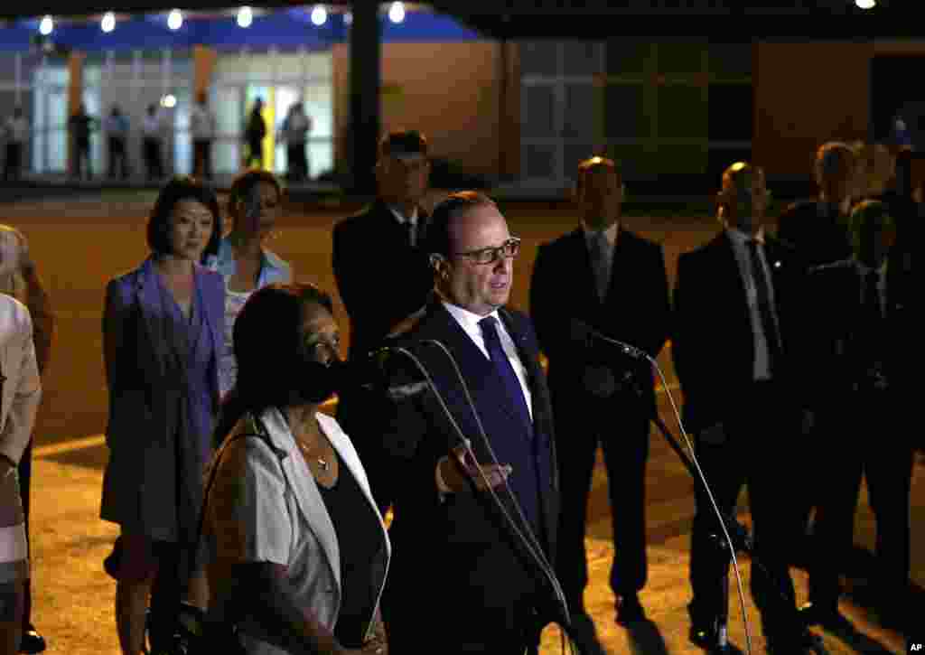 French President Francois Hollande speaks to reporters on the tarmac of Jose Marti International Airport in Havana, May 10, 2015.