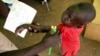 FILE - A Congolese boy has his arm measured for malnutrition in a clinic run by medical charity Medecins Sans Frontieres in the remote town of Dubie in Congo's southeastern Katanga province, March 18, 2006. 