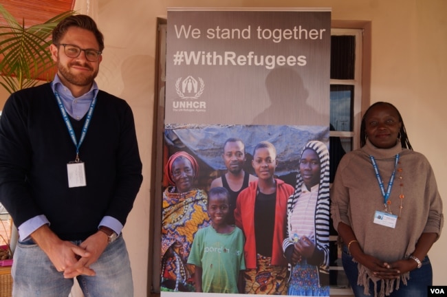 Sebastian Herwig, left, of the associate resettlement officer for the UNHCR in Malawi, poses with UHCR Protection Officer Gloria Muleba Mukama outside the UNHCR offices in the capital Lilongwe. (L. Masina/VOA)