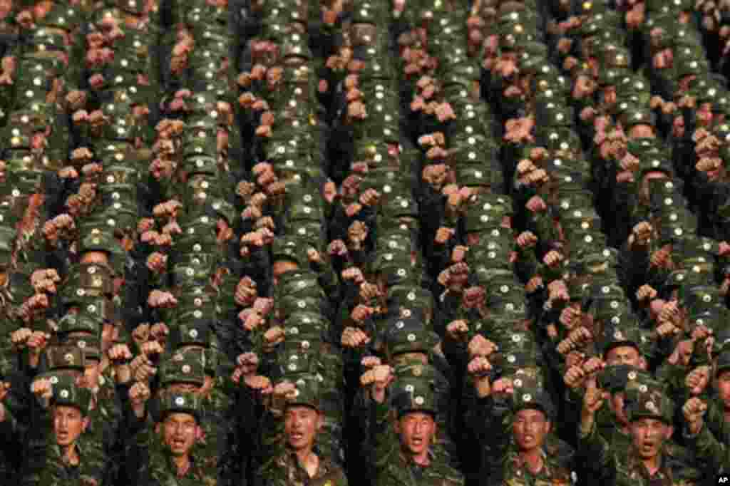 North Korean soldiers chant at Kim Il Sung Square in central Pyongyang, North Korea, during a rally denouncing South Korean President Lee Myung-bak on Friday, April 20, 2012. North Koreans said Lee's radio comments about North Korea last week "hurt the di