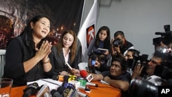 Presidential candidate Keiko Fujimori talks to the media during a meeting with young members of her party in Lima, Peru, May 9, 2011