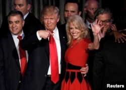 FILE - U.S. President-elect Donald Trump and his campaign manager Kellyanne Conway greet supporters during his election night rally in Manhattan, New York, Nov. 9, 2016.