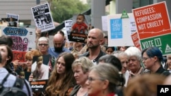 FILE - Protestors against asylum seekers being deported, gather for a rally in Sydney, Australia, Thursday, Feb. 4, 2016. 