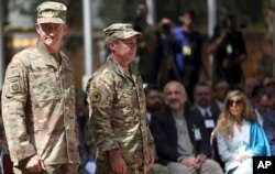 Outgoing U.S. Army Gen. John Nicholson, left, and incoming U.S. Army Gen. Austin Miller, second from left, prepare for the change of command ceremony at Resolute Support headquarters in Kabul, Afghanistan, Sept. 2, 2018.