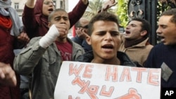 Anti-government demonstrators shout slogans against President Hosni Mubarak in Cairo, Egypt, January 27, 2011.