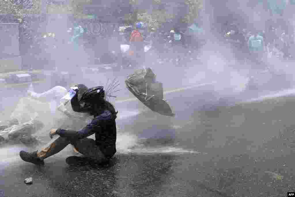 Police use water cannon against demonstrators protesting the government&rsquo;s policy on COVID-19, in Kathmandu, Nepal.
