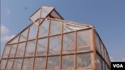 The solar tent is made from clear plastic. The plastic is stretched over a large wooden structure. (Source: VOA)