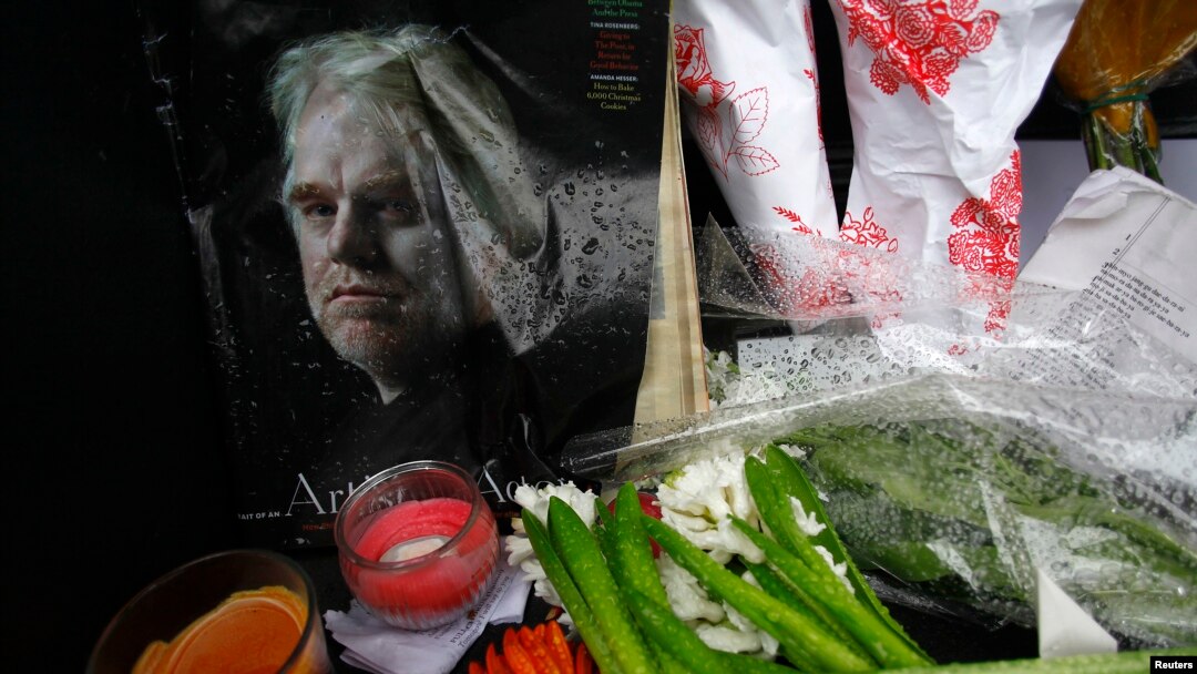 A memorial for movie actor Philip Seymour Hoffman is displayed in front of his apartment building in New York, Feb. 3, 2014.