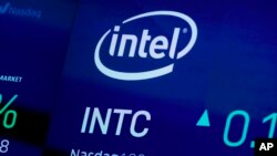 FILE - The symbol for Intel appears on a screen at the Nasdaq MarketSite, in New York on Oct. 1, 2019. 