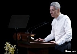Lee Hsien Yang, son of former leader Lee Kuan Yew, delivers a eulogy for his late father, during the funeral service in Singapore, March 29, 2015.