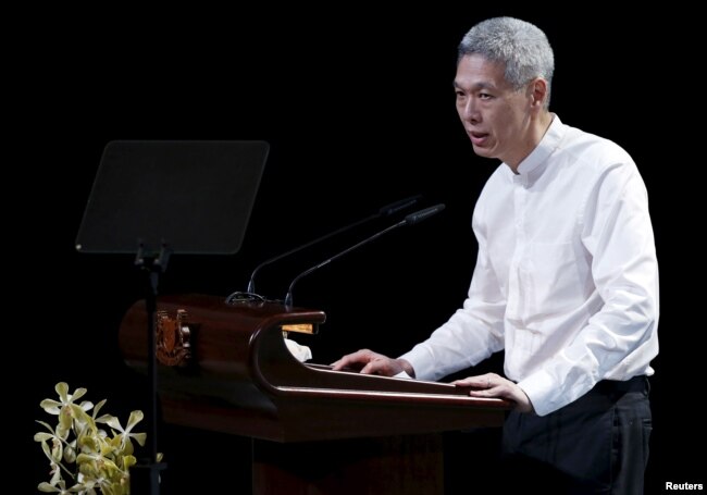 Lee Hsien Yang, son of former leader Lee Kuan Yew, delivers a eulogy for his late father, during the funeral service in Singapore, March 29, 2015.