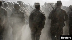 FILE - Afghan National Army (ANA) officers march during a training exercise at the Kabul Military Training Centre in Afghanistan, Oct. 7, 2015. 