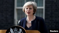 FILE - British Prime Minister Theresa May speaks to reporters outside No. 10 Downing Street in London, July 13, 2016.